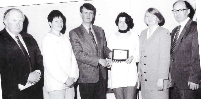 0100 : Ursula Barrett being presented with her prize for an essay competition by Councillor Jim McCarthy.  Also in photo are Seán Burke CEO, Deirdre Barrett, Bridget Joy (teacher) and Martin McNamara (Principal)