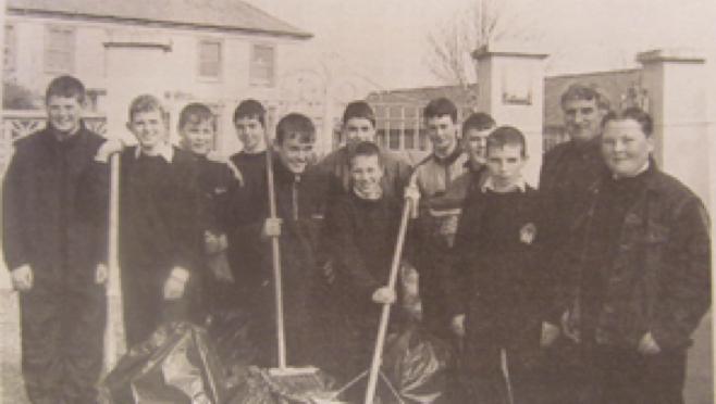 0122 : In 2000, 1st Year students were pictured keeping Newcastle West tidy with their Principal Richard Barry.