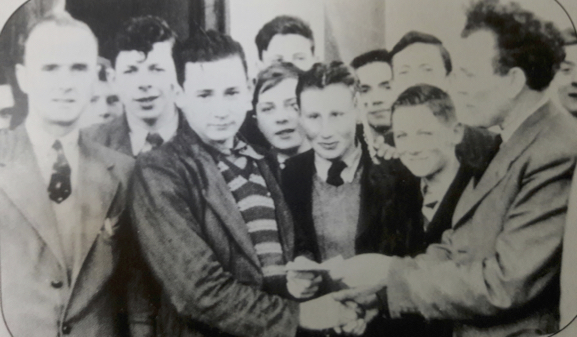 0300 : In 1953 John Delee was awarded 1st prize in Ireland for Woodwork. Pictured with him are fellow students, woodwork teacher Mr Pat Twomey and Principal Mr Eamonn O'Connor.